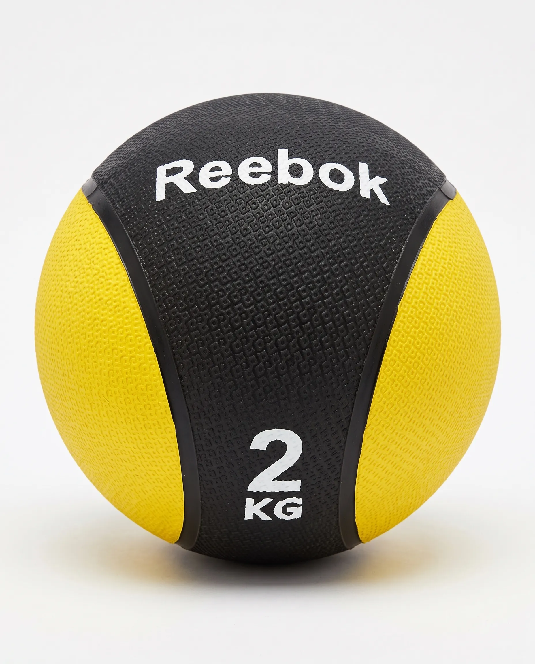 1_11zon كرة طبية ثقيلة لتدريبات القوة من ريبوك (Reebok)، لون أسود وأصفر، 2 كجم - الصورة 1