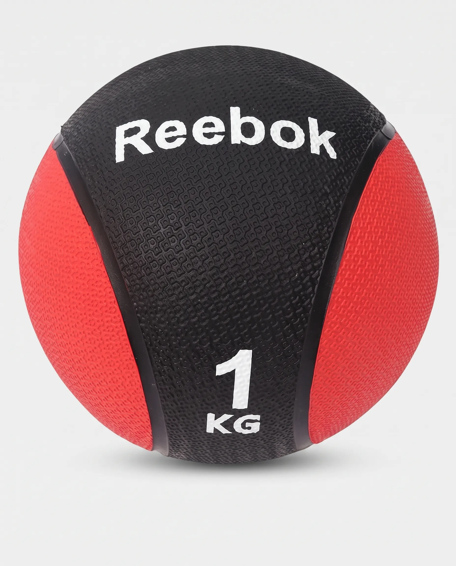1_11zon كرة طبية ثقيلة لتدريبات القوة من ريبوك (Reebok)، بالون الأسود والأحمر، 1 كجم - الصورة 1