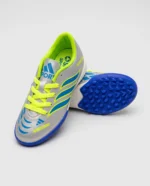 حذاء كرة قدم (ترتان/ستارز) من ماركة Adidas للأطفال من الجنسين، فضي