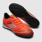 حذاء كرة قدم (ترتان/ستارز) من ماركة Adidas للبالغين من الجنسين، أحمر*أسود