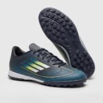 حذاء كرة قدم (ترتان/ستارز) من ماركة Adidas للبالغين من الجنسين، كحلي
