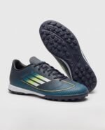 حذاء كرة قدم (ترتان/ستارز) من ماركة Adidas للبالغين من الجنسين، كحلي
