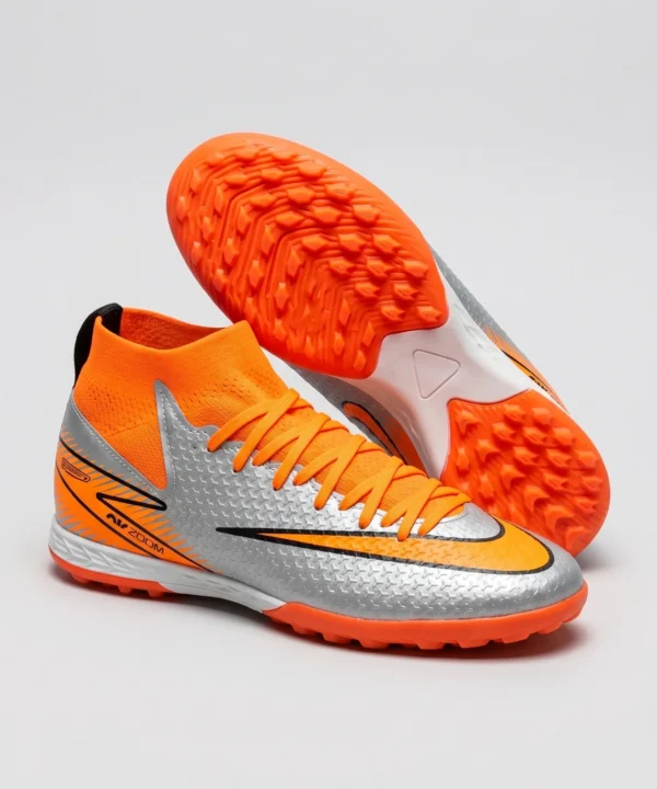 حذاء كرة قدم (ترتان/ستارز) برقبة عالية، من ماركة Nike للاطفال من الجنسين، برتقالي